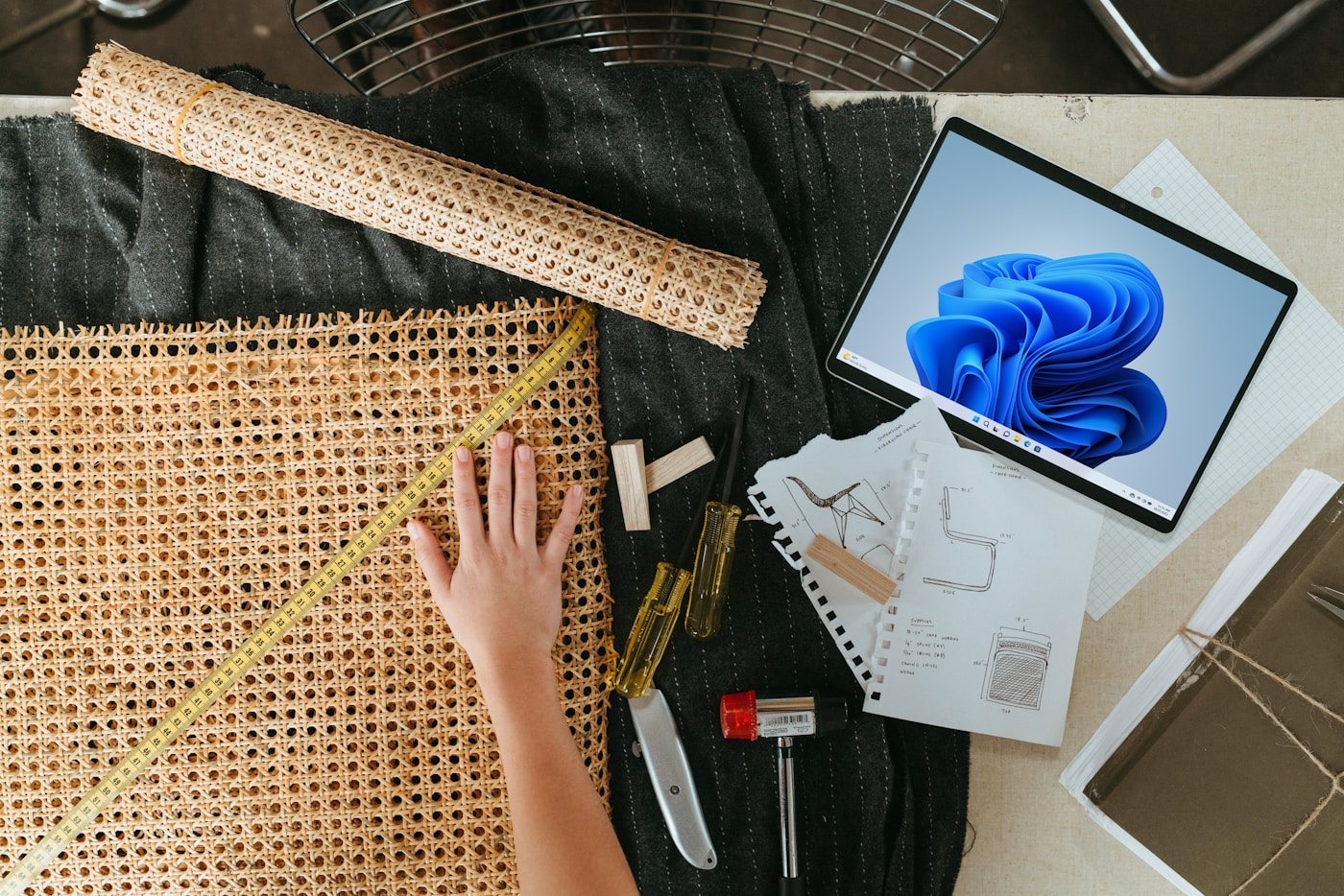 Project planning workspace with design materials and digital tools